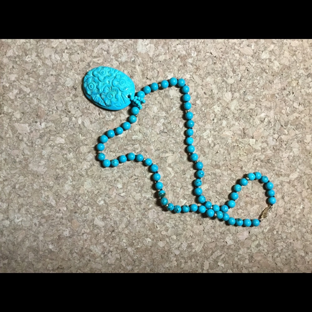 Turquoise and 14k gold pendant and bead necklace.